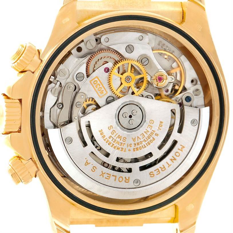 The image shows the movement and internal mechanisms of a Rolex Daytona 16518 Men's Yellow Gold White Dial 16518 Men's Yellow Gold White Dial watch, viewed from the back.