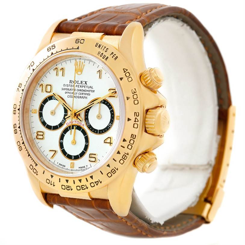 The Rolex Daytona 16518 Men's Yellow Gold White Dial 16518 Men's Yellow Gold White Dial watch is shown at a three-quarter angle, displaying the face, crown, pushers, and leather strap.