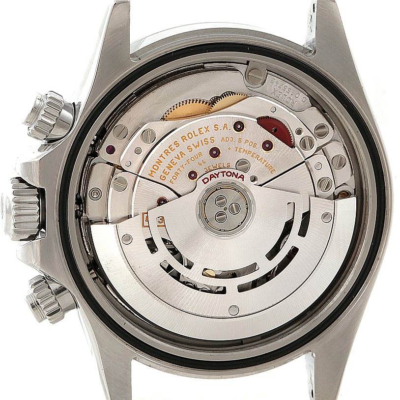 The image shows the back view of a Rolex Daytona 116520 Men
s Stainless Steel White Dial 116520 Men
s Stainless Steel White Dial watch, highlighting its intricate movement and internal components.