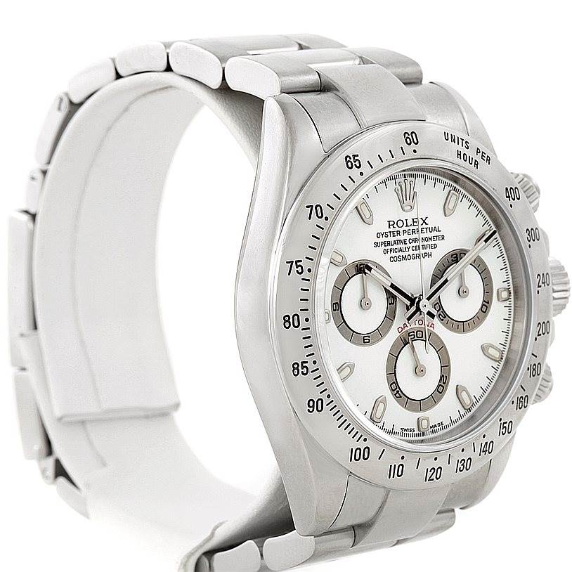 The Rolex Daytona 116520 Men
s Stainless Steel White Dial 116520 Men
s Stainless Steel White Dial watch is shown at an angled side view, displaying part of the bracelet, face, and side crown.