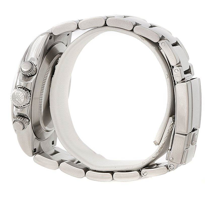 The image shows a side view of the Rolex Daytona 116520 Men
s Stainless Steel White Dial 116520 Men
s Stainless Steel White Dial watch, highlighting its bracelet, case, and crown.