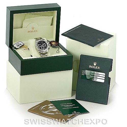 The image shows a Rolex Daytona 116520 Men's Stainless Steel Black Dial 116520 Men's Stainless Steel Black Dial watch with its box, warranty card, and manuals displayed at an angled view.