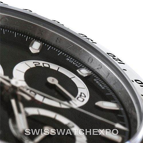 The image shows a close-up angle of a Rolex Daytona 116520 Men's Stainless Steel Black Dial 116520 Men's Stainless Steel Black Dial watch, focusing on part of the dial and bezel.