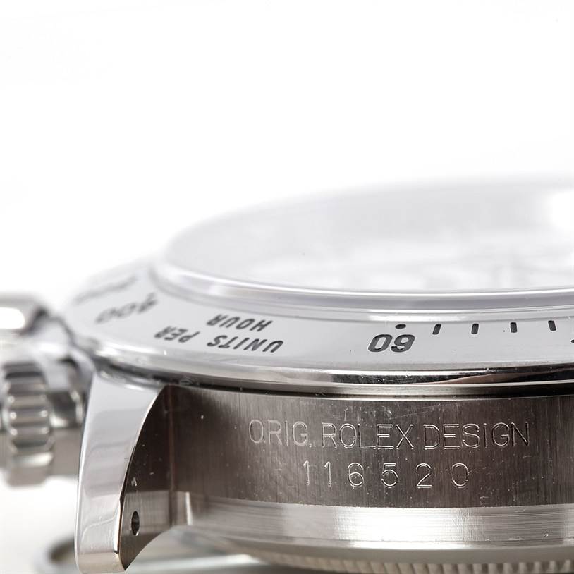 The image shows a side angle of the Rolex Daytona 116520 Men's Stainless Steel White Dial 116520 Men's Stainless Steel White Dial watch, highlighting its bezel, crown, and engraved case markings.