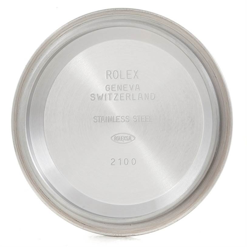 The image shows the interior view of the case back for a Rolex Daytona 116520 Men's Stainless Steel White Dial 116520 Men's Stainless Steel White Dial model watch, displaying branding and material information.