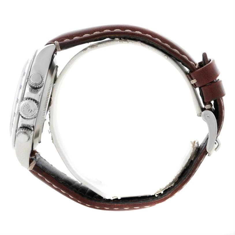 The image shows a side view of a Rolex Daytona 116520 Men's Stainless Steel White Dial 116520 Men's Stainless Steel White Dial watch, highlighting its case, crown, pushers, and leather strap.