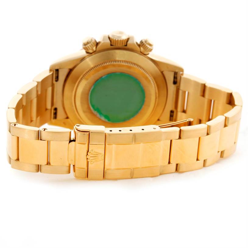 This image shows the Rolex Daytona Men's Yellow Gold Black Dial Men's Yellow Gold Black Dial watch from the rear, displaying the clasp, bracelet, and case back.