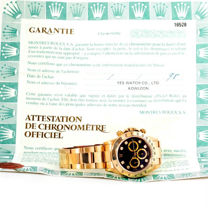 The image shows a Rolex Daytona Men's Yellow Gold Black Dial Men's Yellow Gold Black Dial watch with a black dial, gold bracelet, and bezel, alongside its official certificate and warranty card.
