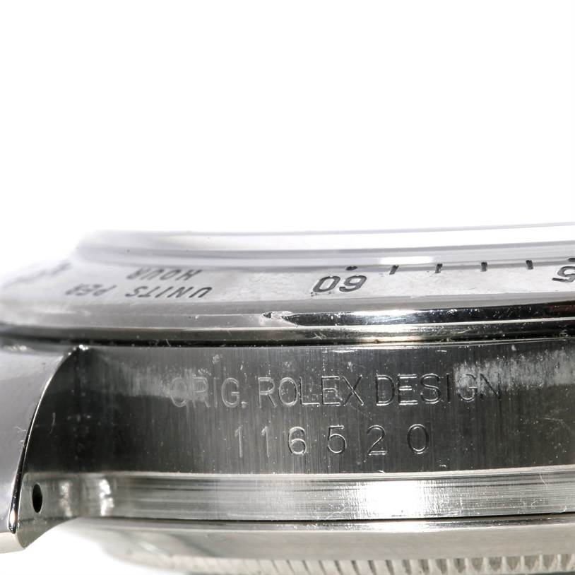 The image shows a close-up side view of the bezel and case of a Rolex Daytona 116520 Men's Stainless Steel White Dial 116520 Men's Stainless Steel White Dial watch, with design and model numbers engraved.