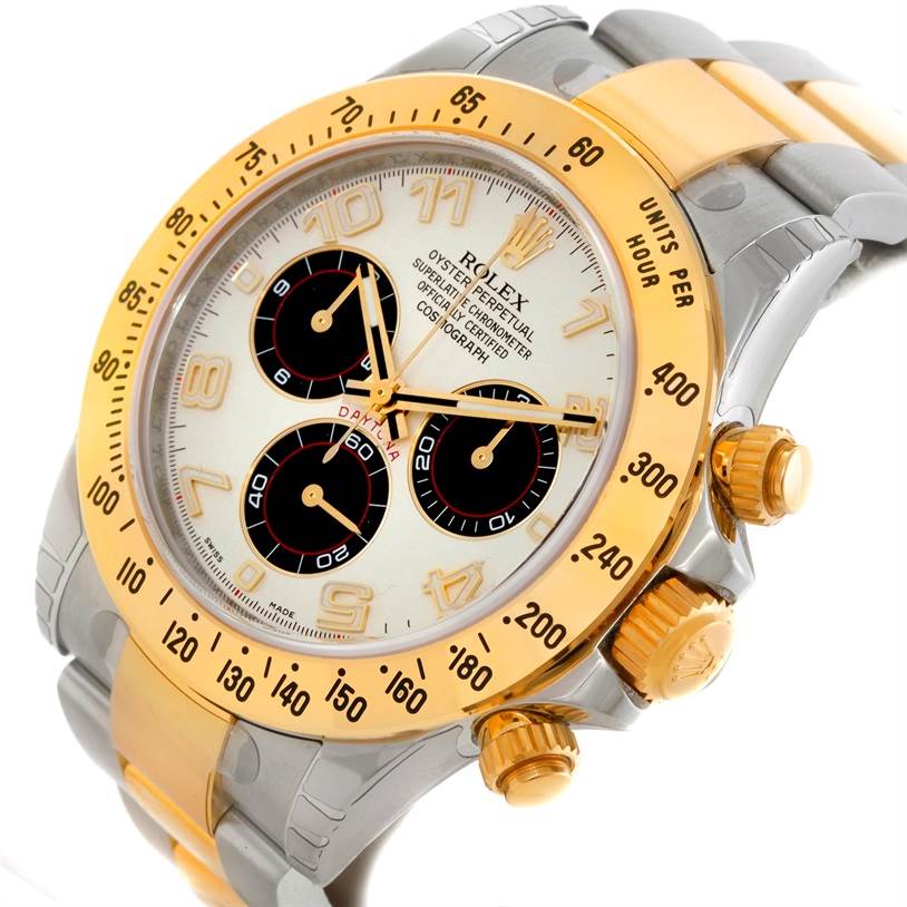 This image shows a close-up angle of the Rolex Daytona 116523 Men's Steel and Gold (two tone) White Dial 116523 Men's Steel and Gold (two tone) White Dial watch, highlighting its gold bezel, dial, and pushers.