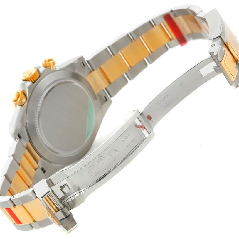 The image shows the back and clasp of a Rolex Daytona 116523 Men's Steel and Gold (two tone) White Dial 116523 Men's Steel and Gold (two tone) White Dial watch, highlighting the two-tone metal strap.