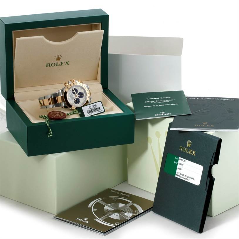 The image shows a Rolex Daytona 116523 Men's Steel and Gold (two tone) White Dial 116523 Men's Steel and Gold (two tone) White Dial watch in its box with documentation and accessories, viewed from the front.
