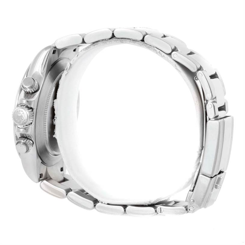 The image shows a side view of a Rolex Daytona 116520 Men's Stainless Steel White Dial 116520 Men's Stainless Steel White Dial watch, focusing on the bracelet and the crown side of the case.