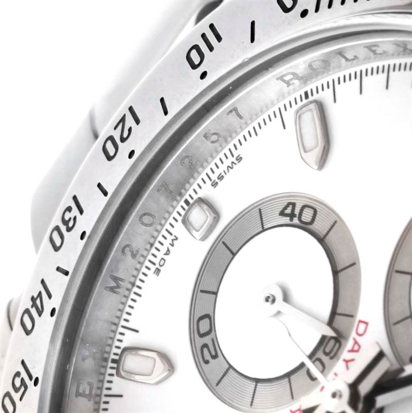 This close-up shows the dial, bezel, and part of the sub-dials on a Rolex Daytona 116520 Men's Stainless Steel White Dial 116520 Men's Stainless Steel White Dial watch.