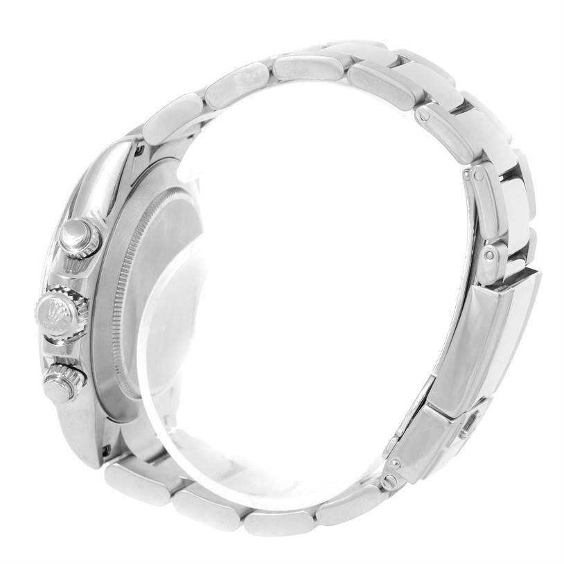 The image shows a side view of a Rolex Daytona 116520 Men's Stainless Steel Black Dial 116520 Men's Stainless Steel Black Dial watch, focusing on its crown, pushers, and bracelet.