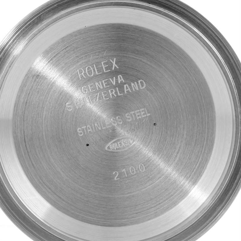 The image shows the inside case back of a Rolex Daytona 116520 Men's Stainless Steel White Dial 116520 Men's Stainless Steel White Dial watch, engraved with brand and manufacturing details.