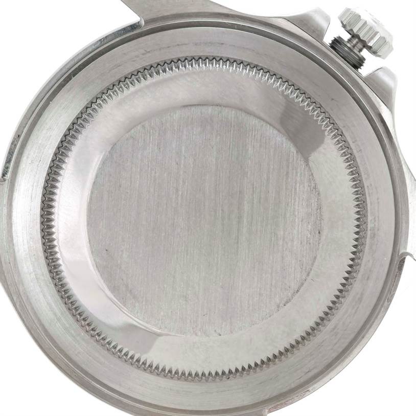 This image shows the back case cover and crown of a Rolex Explorer 16570 Men's Stainless Steel White Dial 16570 Men's Stainless Steel White Dial watch from a top-down angle.