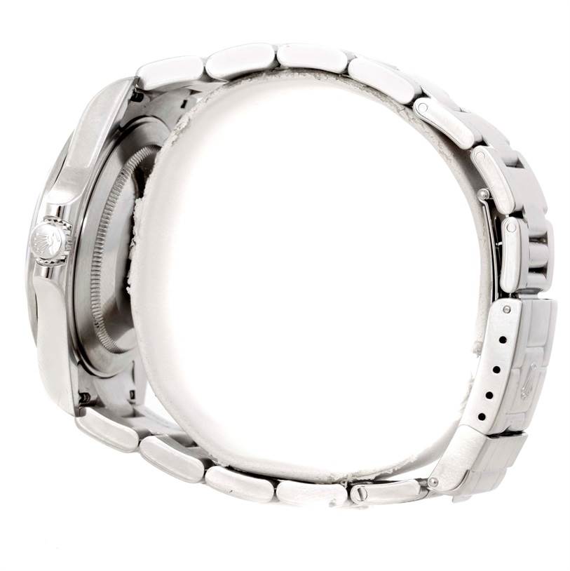 The image shows a side view of the Rolex Explorer 16570 Men's Stainless Steel White Dial 16570 Men's Stainless Steel White Dial watch, highlighting its metal bracelet, crown, and clasp.