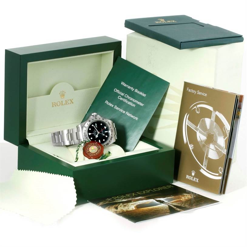 The image shows the Rolex Explorer 16570 Men's Stainless Steel Black Dial 16570 Men's Stainless Steel Black Dial model watch with its box, warranty booklet, certification, service guide, and an additional booklet.
