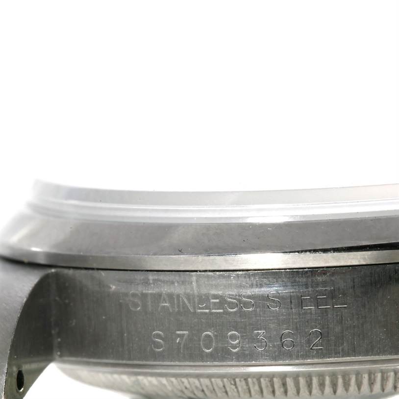 The image shows a close-up of the side and bezel edge of the Rolex Explorer 14270 Men's Stainless Steel Black Dial 14270 Men's Stainless Steel Black Dial watch with visible engraving.