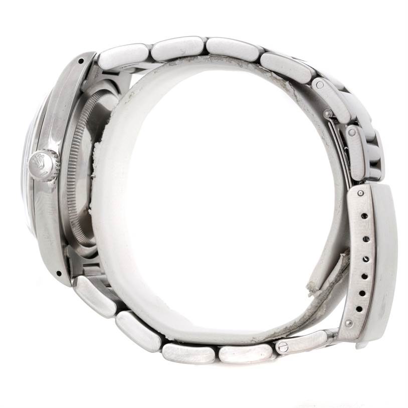 The Rolex Explorer 14270 Men's Stainless Steel Black Dial 14270 Men's Stainless Steel Black Dial watch is shown from a side view, displaying the crown, case, and bracelet.