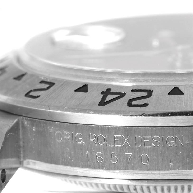 This image shows a close-up of the bezel and the side of the Explorer model by Rolex, including the model number 16570.
