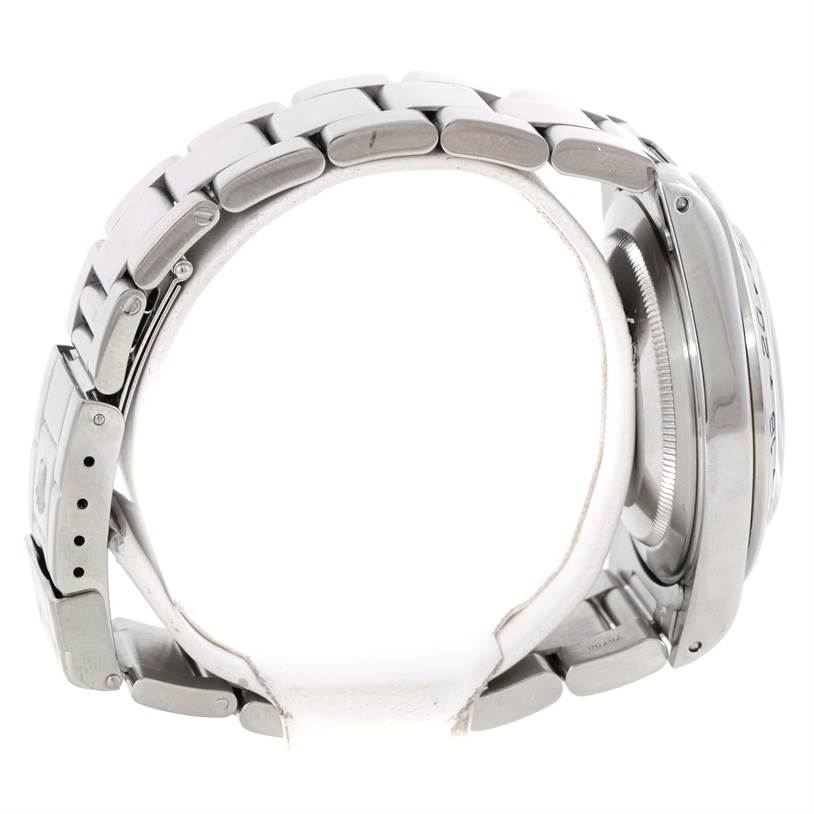 The image shows a side view of the Rolex Explorer 16570 Men's Stainless Steel White Dial 16570 Men's Stainless Steel White Dial model, focusing on the bracelet and case.