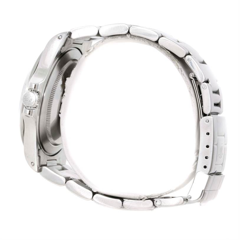 The image shows a side view of the Rolex Explorer 16570 Men's Stainless Steel White Dial 16570 Men's Stainless Steel White Dial watch, highlighting the case, crown, and part of the bracelet.