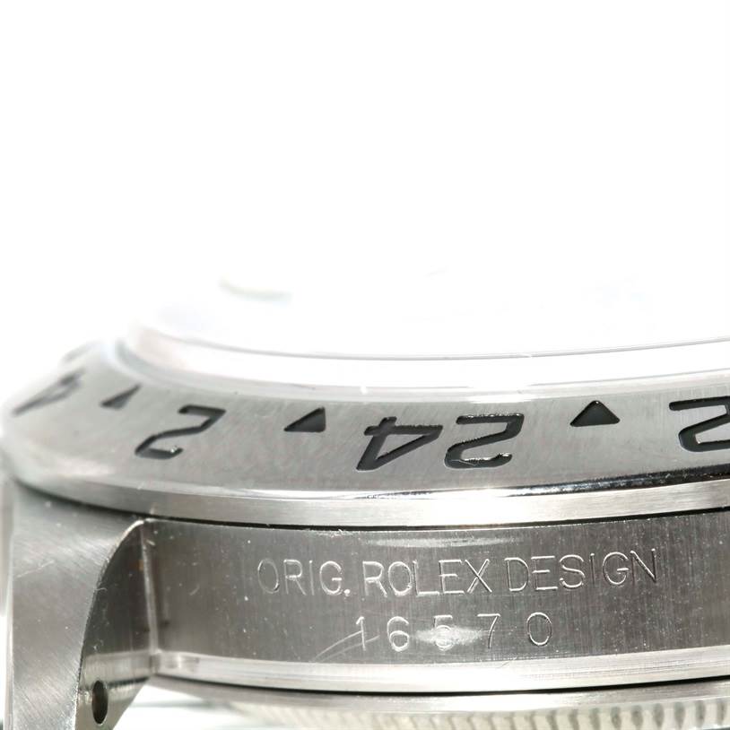 The image shows a side view of the bezel and case of a Rolex Explorer 16570 Men's Stainless Steel White Dial 16570 Men's Stainless Steel White Dial, showcasing the model number 16570.