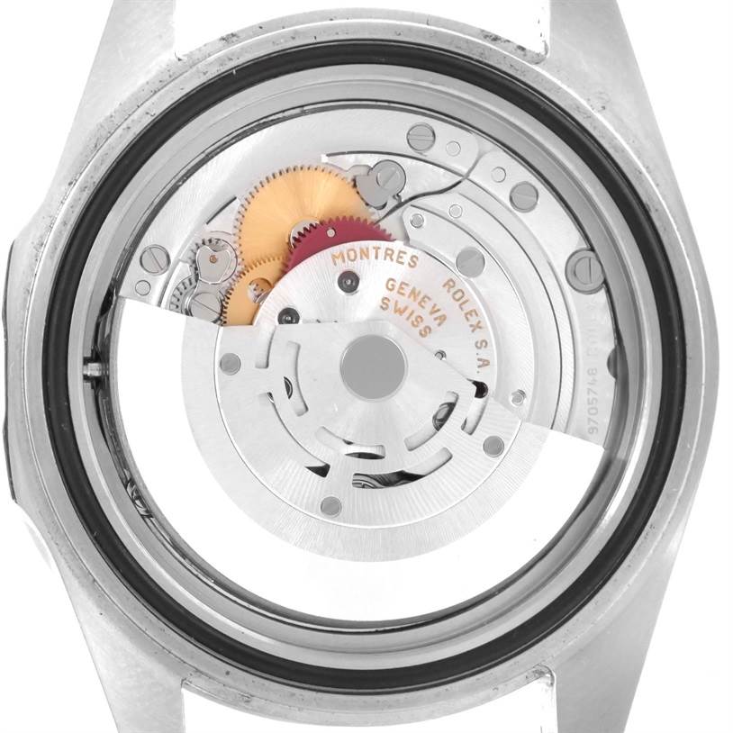 The image shows the back view of a Rolex Explorer 16570 Men's Stainless Steel White Dial 16570 Men's Stainless Steel White Dial watch, revealing its internal mechanisms and gears.