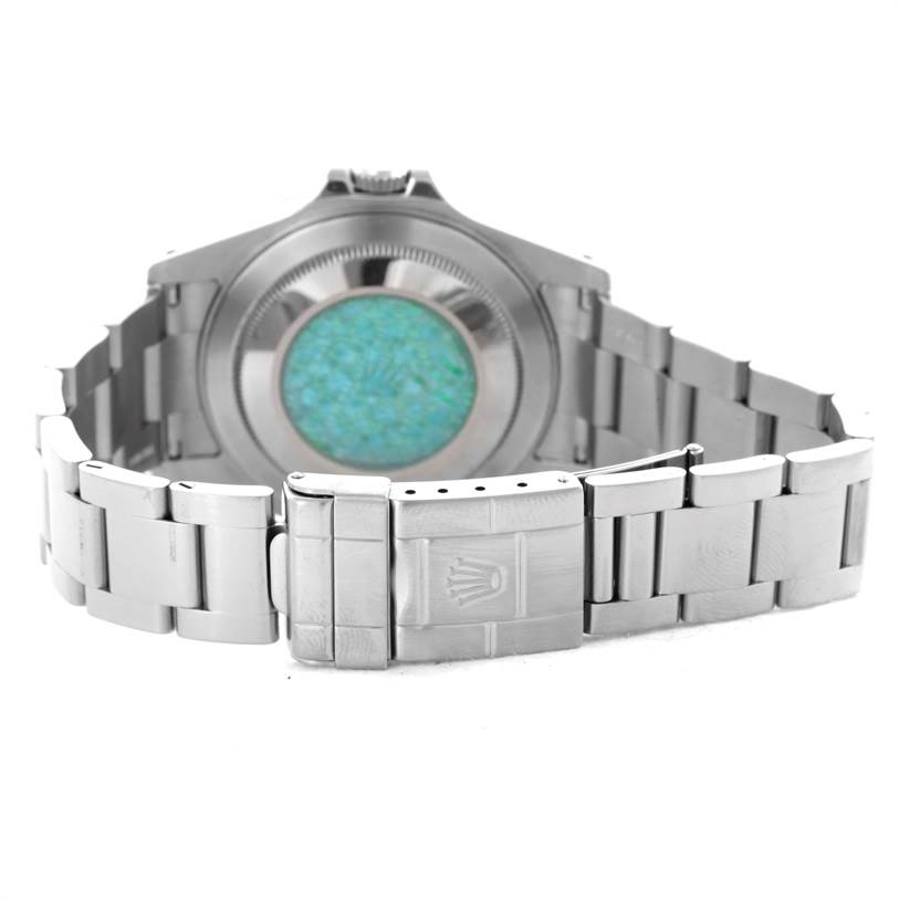 The image shows the back view of a Rolex Explorer 16570 Men's Stainless Steel White Dial 16570 Men's Stainless Steel White Dial watch, highlighting its stainless steel case back and bracelet clasp with the Rolex logo.