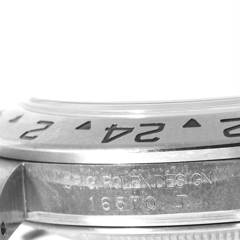 The image shows a close-up of the bezel and case side engraving of a Rolex Explorer 16570 Men's Stainless Steel Black Dial 16570 Men's Stainless Steel Black Dial watch, model reference 16570.
