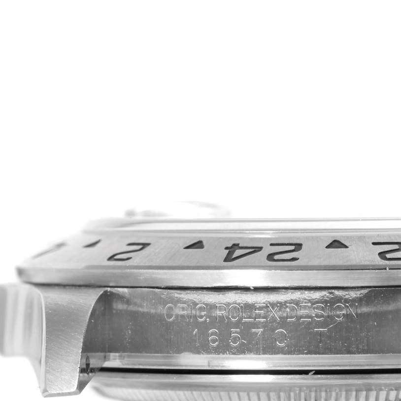 This image shows a close-up, side view of the bezel and case of a Rolex Explorer 16570 Men's Stainless Steel Black Dial 16570 Men's Stainless Steel Black Dial watch, highlighting the model number and design engraving.