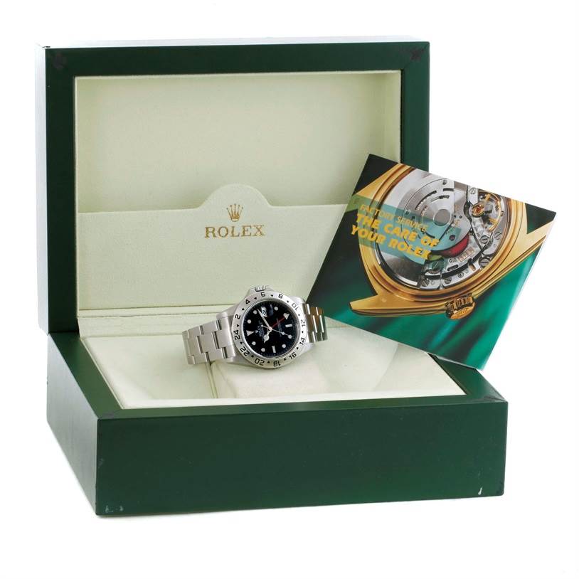 The image shows a Rolex Explorer 16570 Men's Stainless Steel Black Dial 16570 Men's Stainless Steel Black Dial watch inside its green box, along with the accompanying manual booklet.