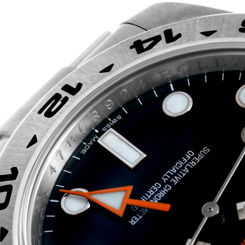 This image shows a close-up of the bezel and face of a Rolex Explorer 216570 Men
s Stainless Steel Black Dial 216570 Men
s Stainless Steel Black Dial watch, highlighting the hour markers and part of the second hand.