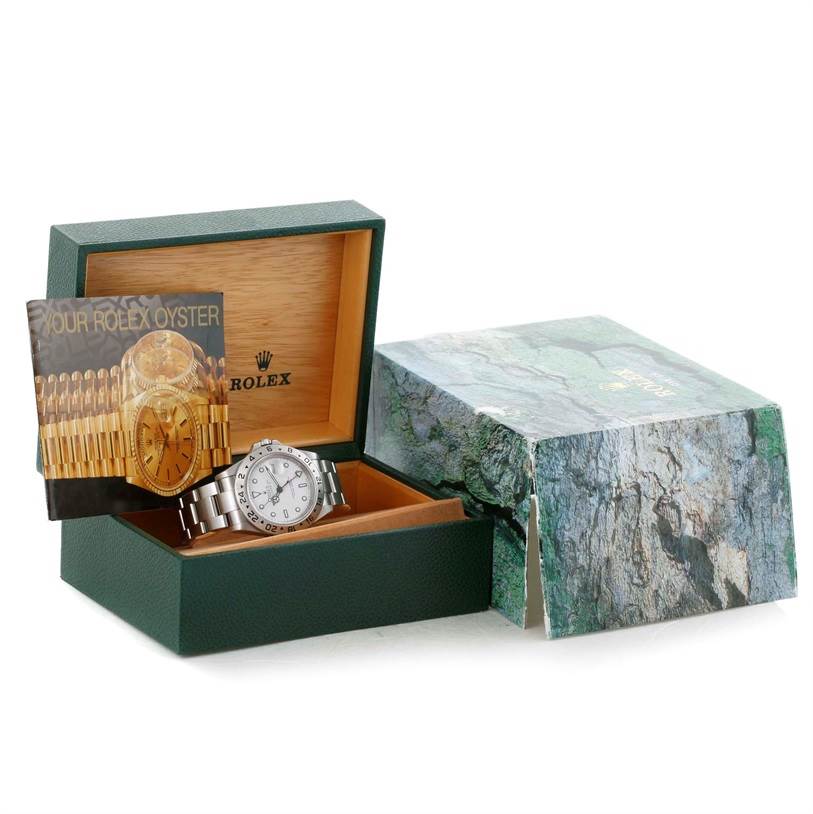 The image shows a Rolex Explorer 16570 Men's Stainless Steel White Dial 16570 Men's Stainless Steel White Dial watch in its open display box, accompanied by a brochure and an outer box.