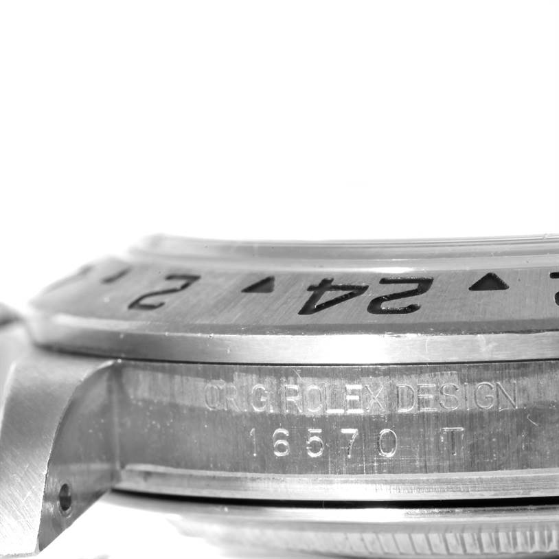 This image shows a close-up side angle of the bezel and case of a Rolex Explorer 16570 Men's Stainless Steel White Dial 16570 Men's Stainless Steel White Dial model, revealing the model number 16570.