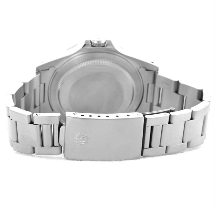 The image shows the back view of the Rolex Explorer 16570 Men's Stainless Steel White Dial 16570 Men's Stainless Steel White Dial watch, displaying its clasp, metal bracelet, and case back.