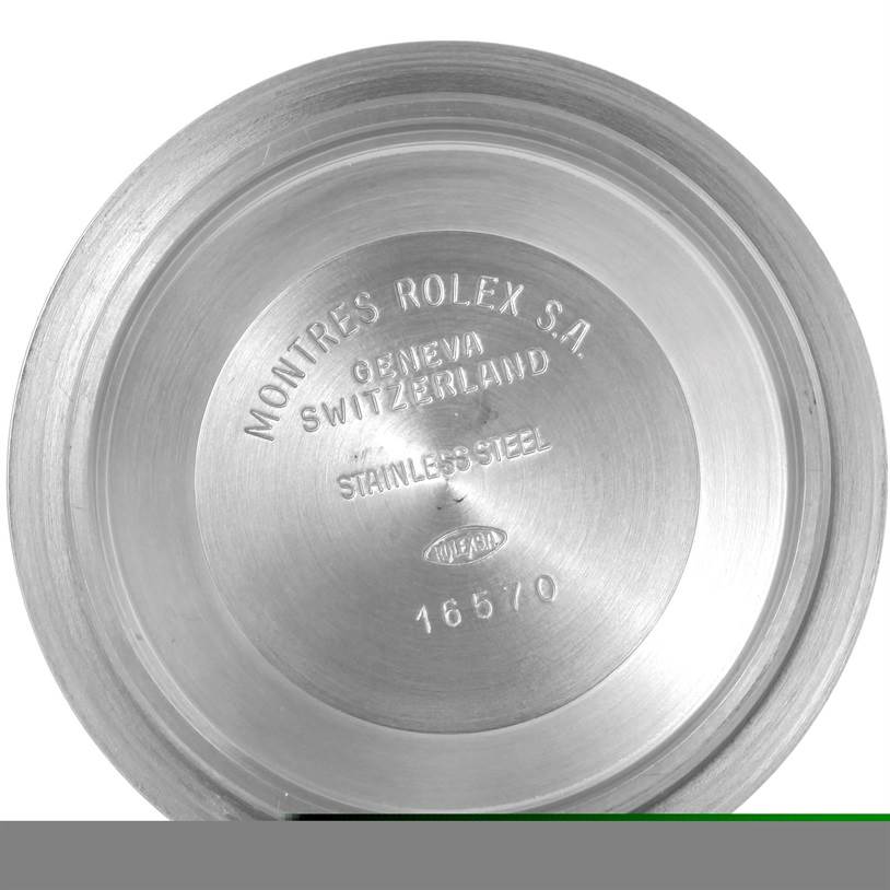 The image shows the inside of the case back of a Rolex Explorer 16570 Men's Stainless Steel White Dial 16570 Men's Stainless Steel White Dial watch, displaying the brand, model details, and material.