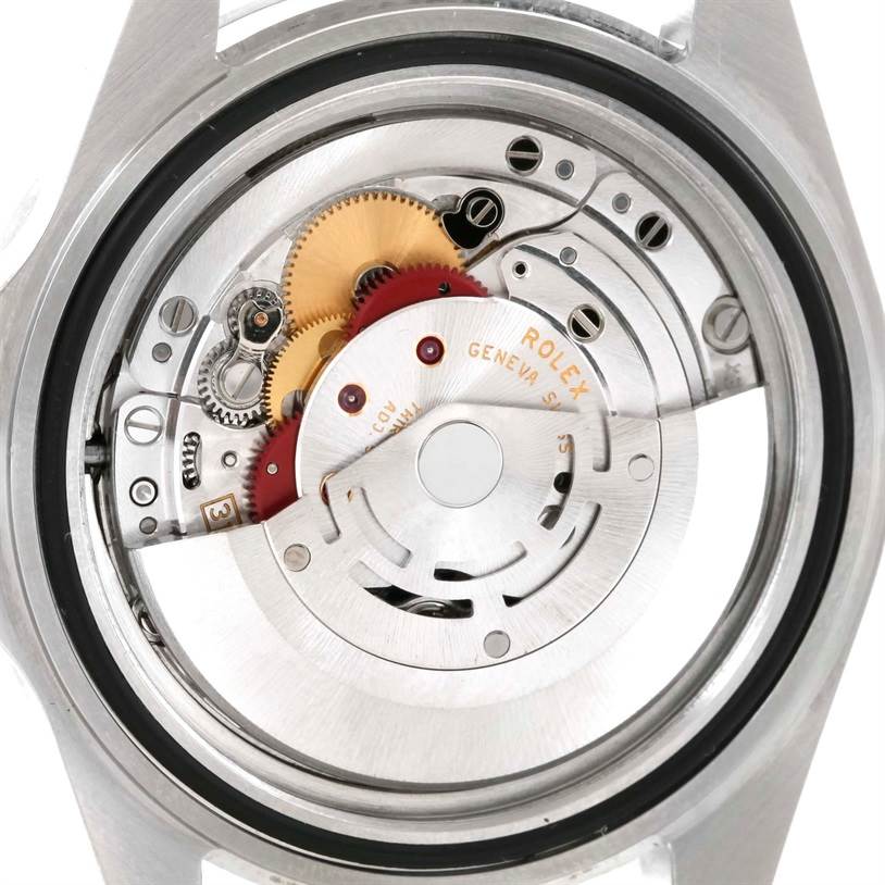 This image shows the internal mechanism of the Rolex Explorer 16570 Men's Stainless Steel White Dial 16570 Men's Stainless Steel White Dial watch from a rear angle with its gears and rotor visible.