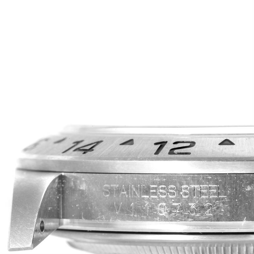 The image shows a side view of a Rolex Explorer 16570 Men's Stainless Steel White Dial 16570 Men's Stainless Steel White Dial watch, highlighting its bezel, case, and part of the lug.