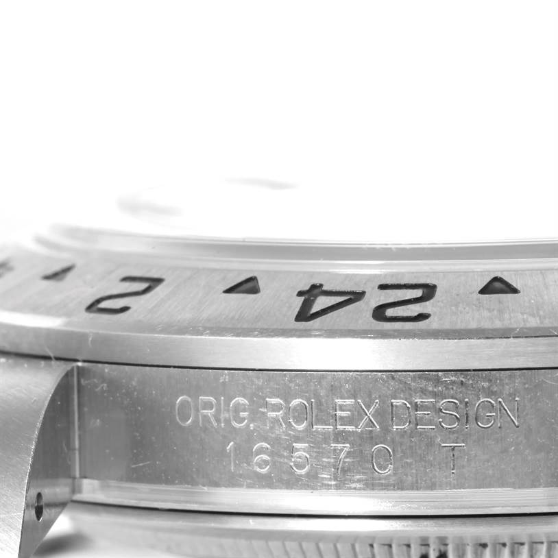 This image shows a close-up side view of the bezel and engraving of the Rolex Explorer 16570 Men's Stainless Steel White Dial 16570 Men's Stainless Steel White Dial watch model 16570.