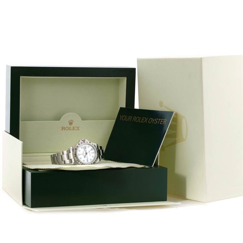 The image shows a Rolex Explorer 16570 Men's Stainless Steel White Dial 16570 Men's Stainless Steel White Dial model watch inside its opened box, along with accompanying documents.