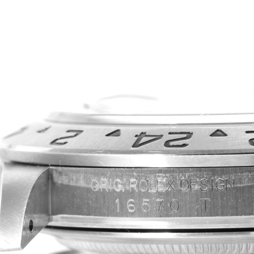 This close-up image of a Rolex Explorer 16570 Men's Stainless Steel Black Dial 16570 Men's Stainless Steel Black Dial watch shows its engraved bezel and case with the model number 16570.