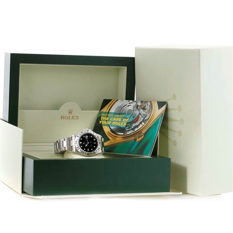 The Rolex Explorer 16570 Men's Stainless Steel Black Dial 16570 Men's Stainless Steel Black Dial watch is shown laying in its open box alongside a booklet, all viewed from a front angle.