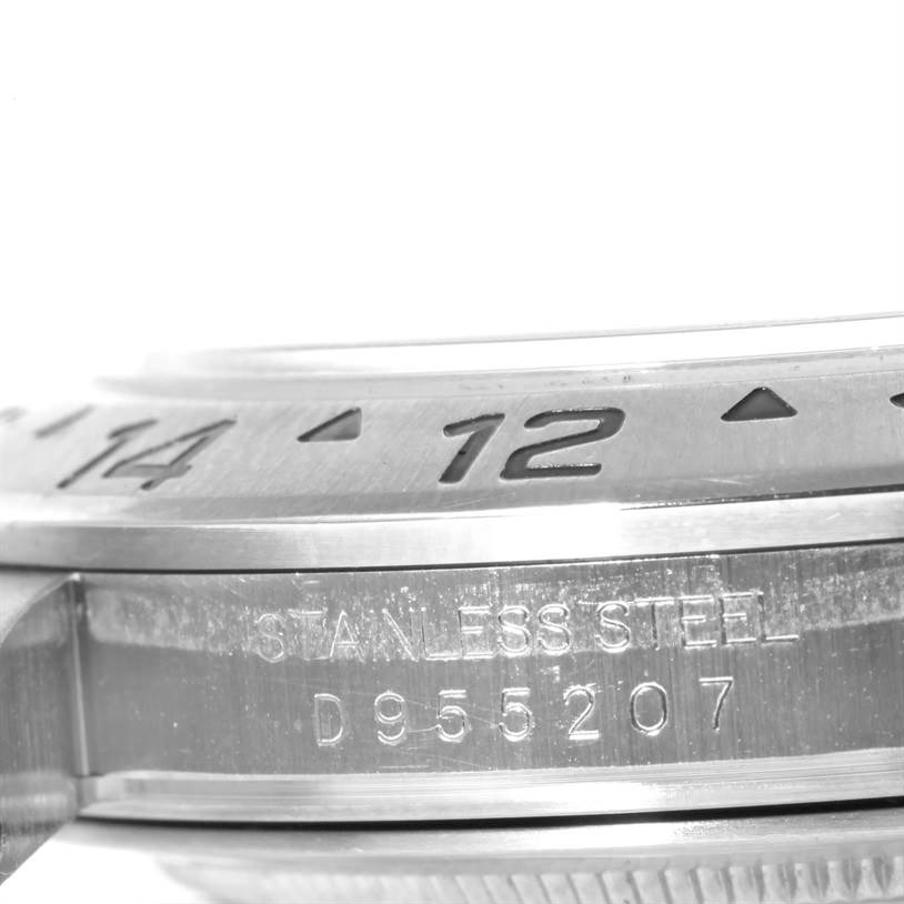 The close-up image shows the bezel and part of the case of the Rolex Explorer 16570 Men's Stainless Steel Black Dial 16570 Men's Stainless Steel Black Dial watch with the serial number engraved.