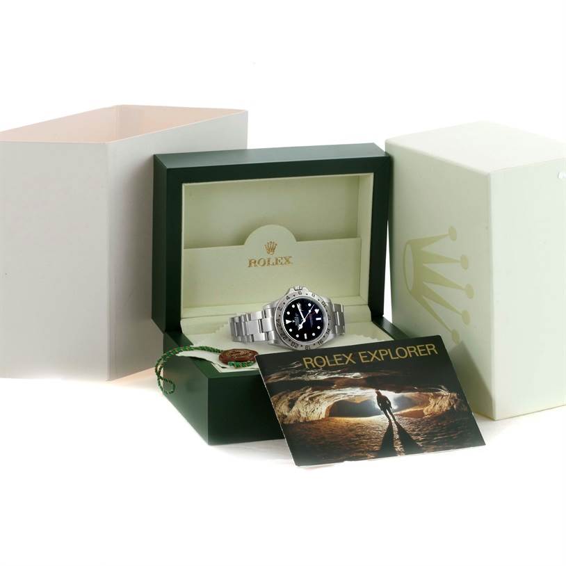 The image shows a Rolex Explorer 16570 Men's Stainless Steel Black Dial 16570 Men's Stainless Steel Black Dial watch in its open box, with accompanying tags and a booklet.