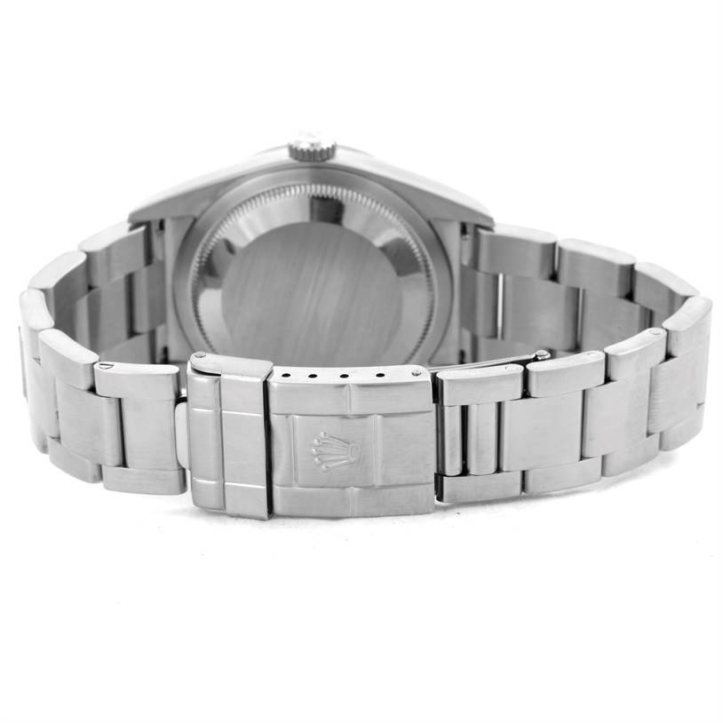 The image shows the back of the Rolex Explorer 114270 Men's Stainless Steel Black Dial 114270 Men's Stainless Steel Black Dial watch, highlighting the case back and the bracelet clasp.