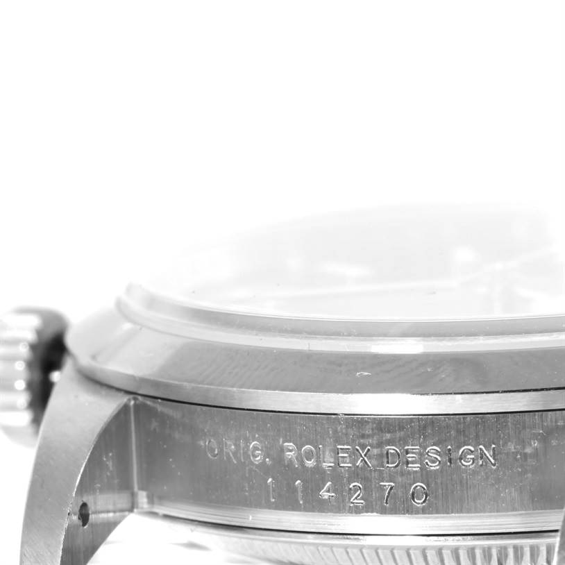 This image shows a side view of a Rolex Explorer 114270 Men's Stainless Steel Black Dial 114270 Men's Stainless Steel Black Dial watch, featuring the case, the crown, and part of the bezel with the model number etched on it.