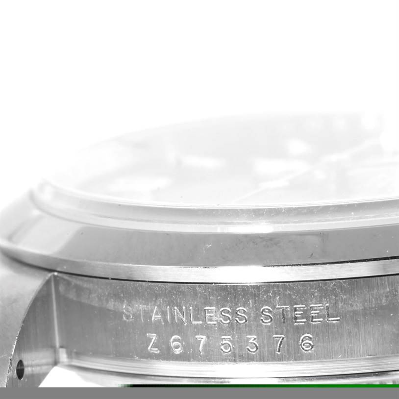 The image shows a side view of the stainless steel casing with the serial number of the Rolex Explorer 114270 Men's Stainless Steel Black Dial 114270 Men's Stainless Steel Black Dial watch.